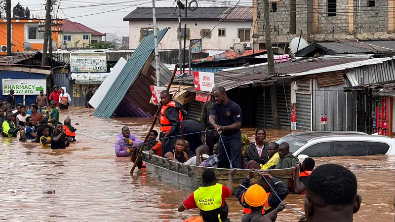 Rescue teams evacuating residents by boat