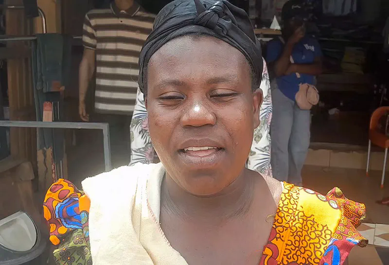 Mavis Adwoa Benewaa displaying ginger at the market